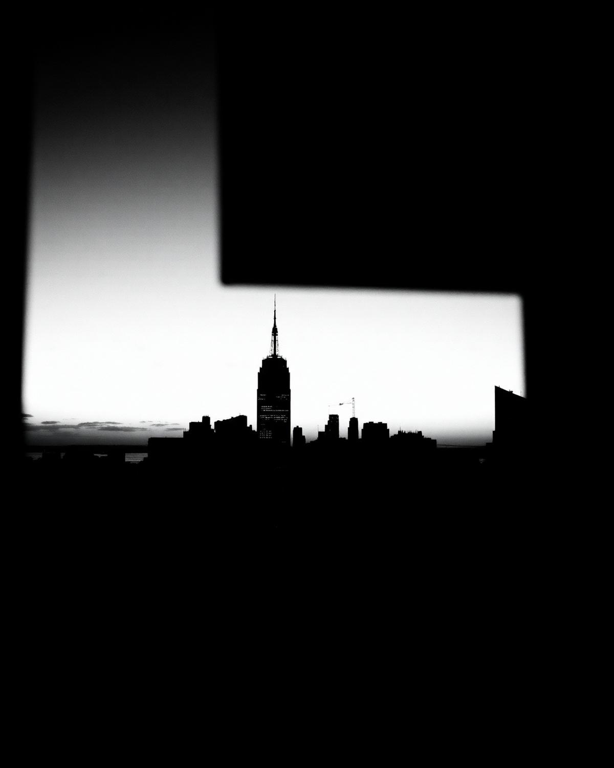Manhattan skyline silhouetted at dusk